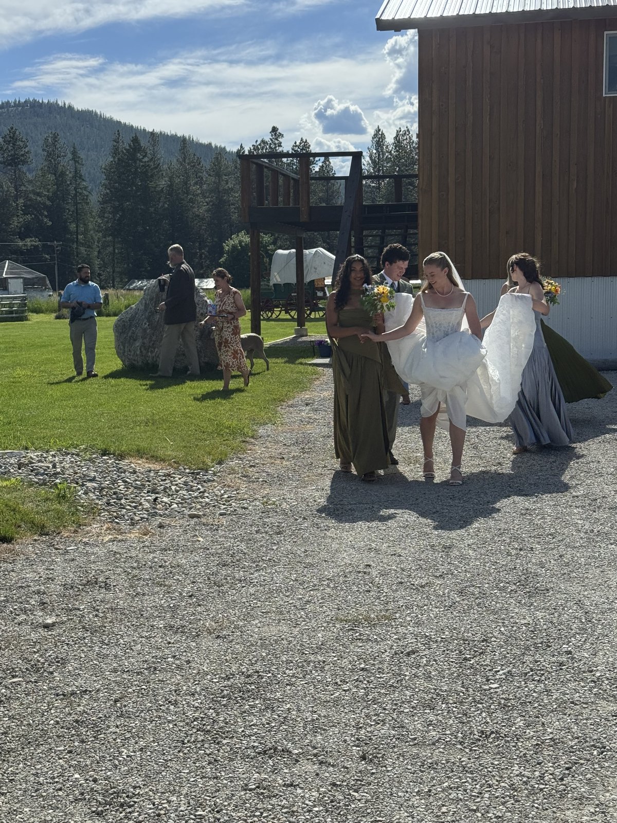Bride and groom embracing beside a Montana trolley