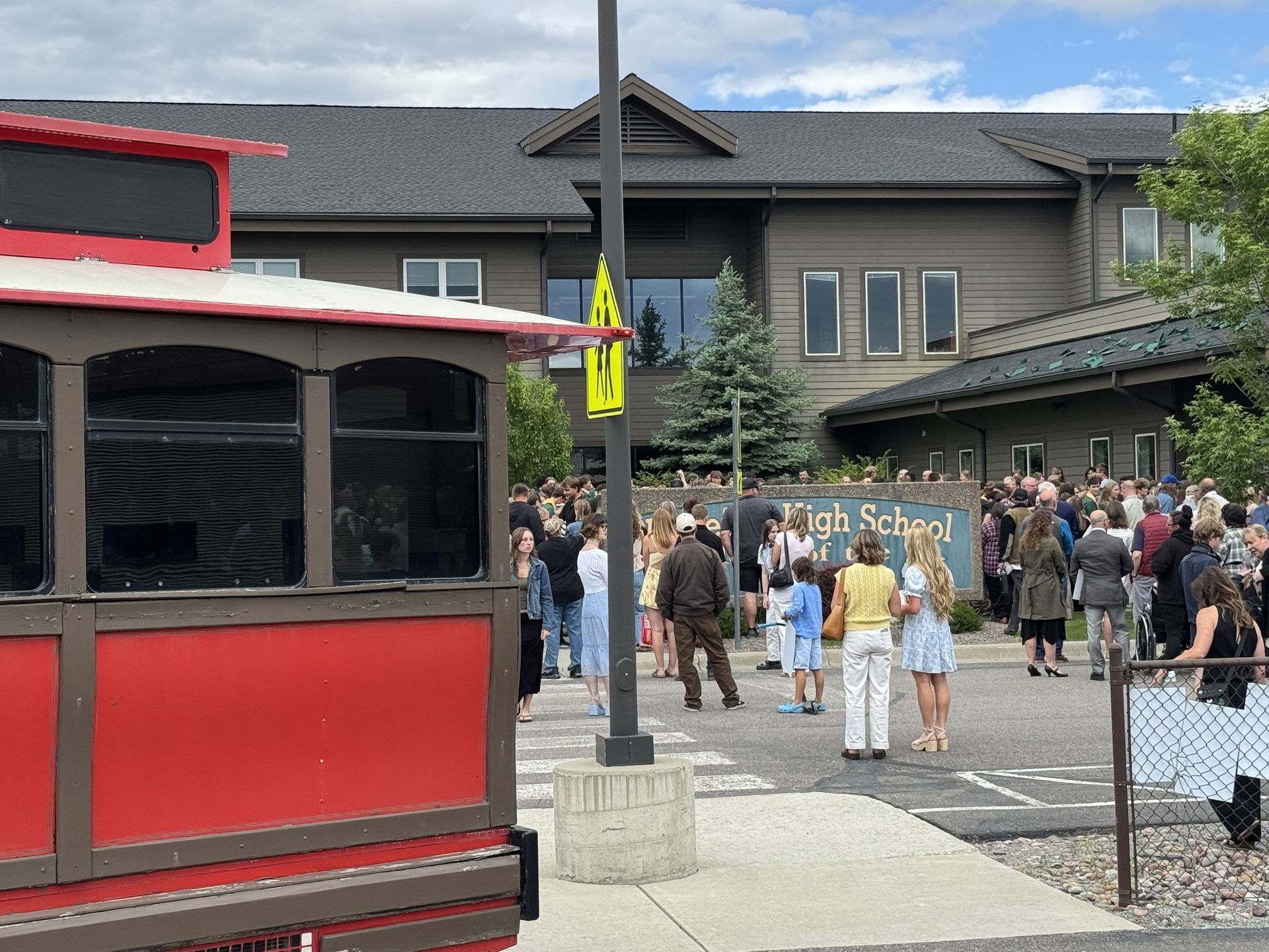 Guests gathering around a Montana trolley at a community event